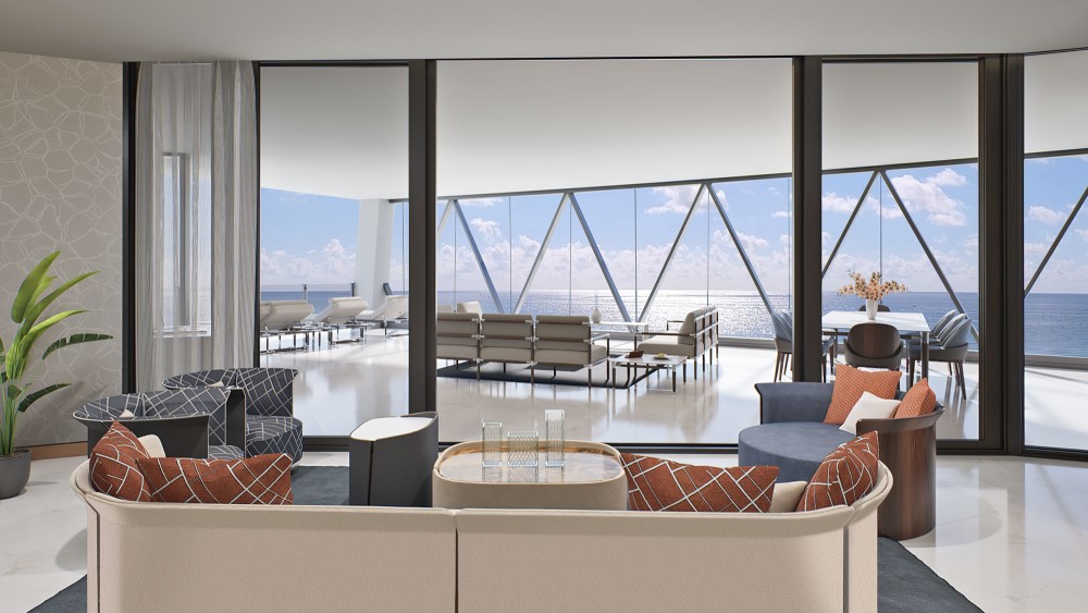 Upscale sitting area with large sliding glass doors opening onto a terrace with more seating