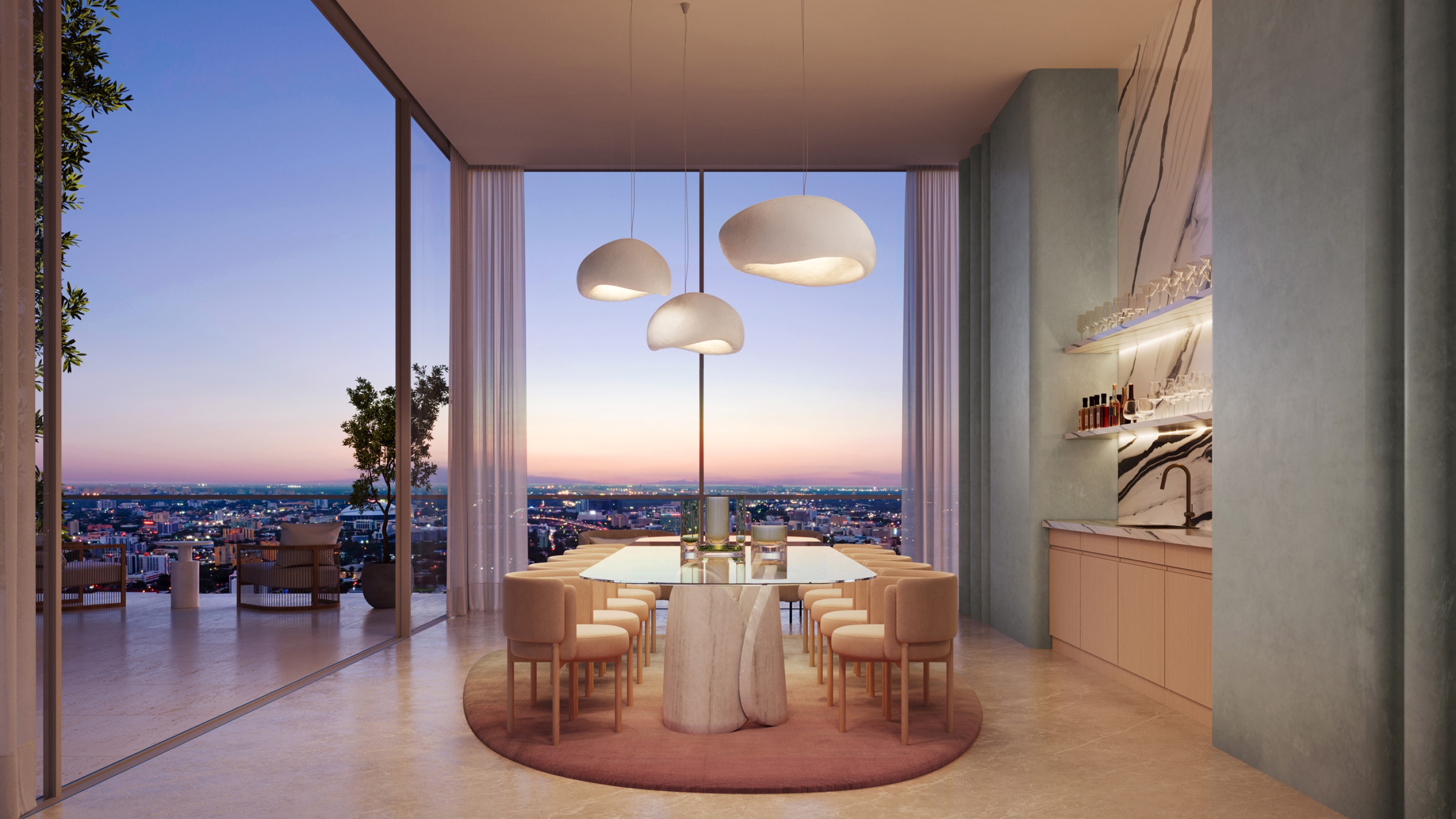 Condo dining room with view of downtown Miami cityscape during night
