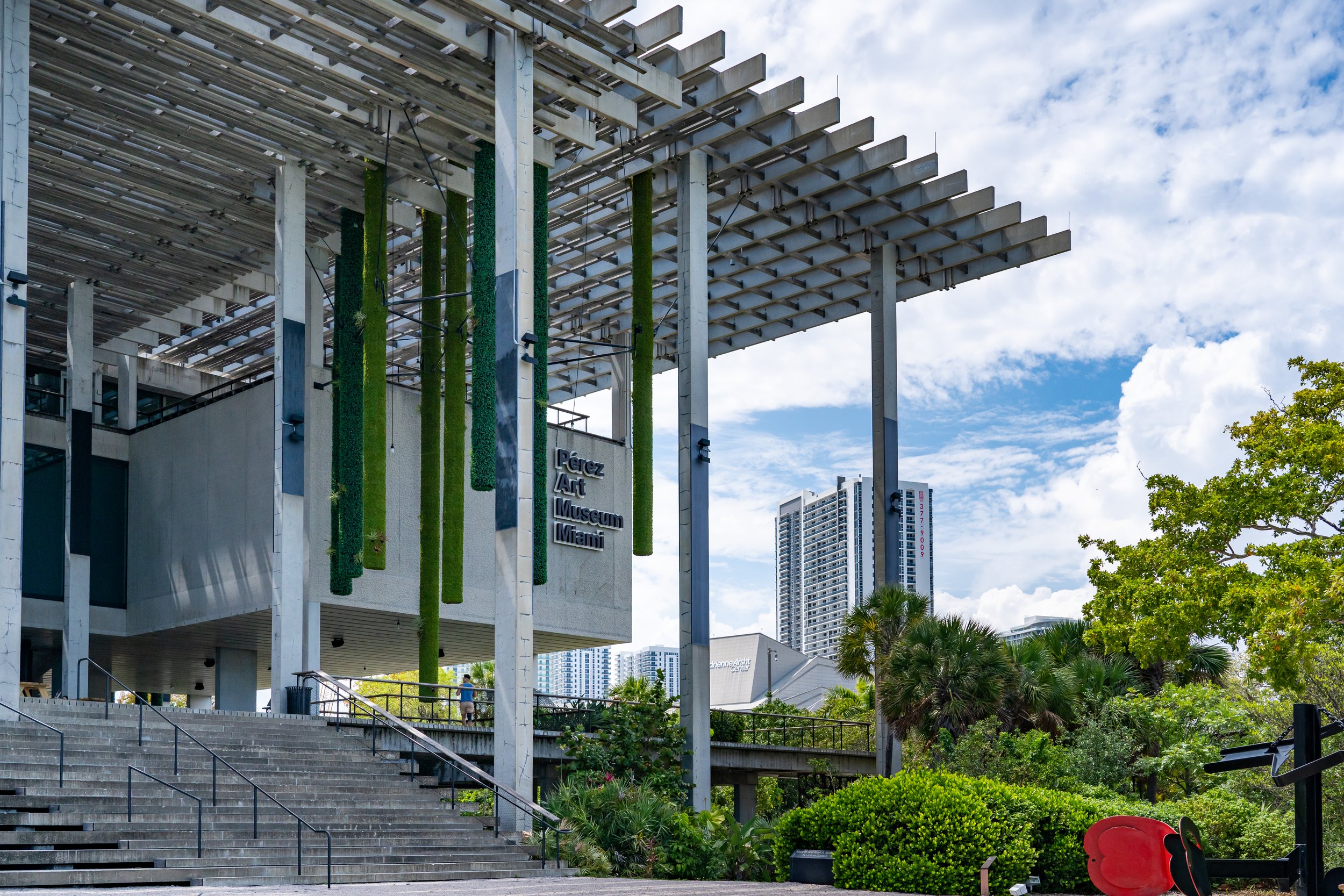 Exterior view of the Pérez Art Museum Miami with a luxury hotel in the background