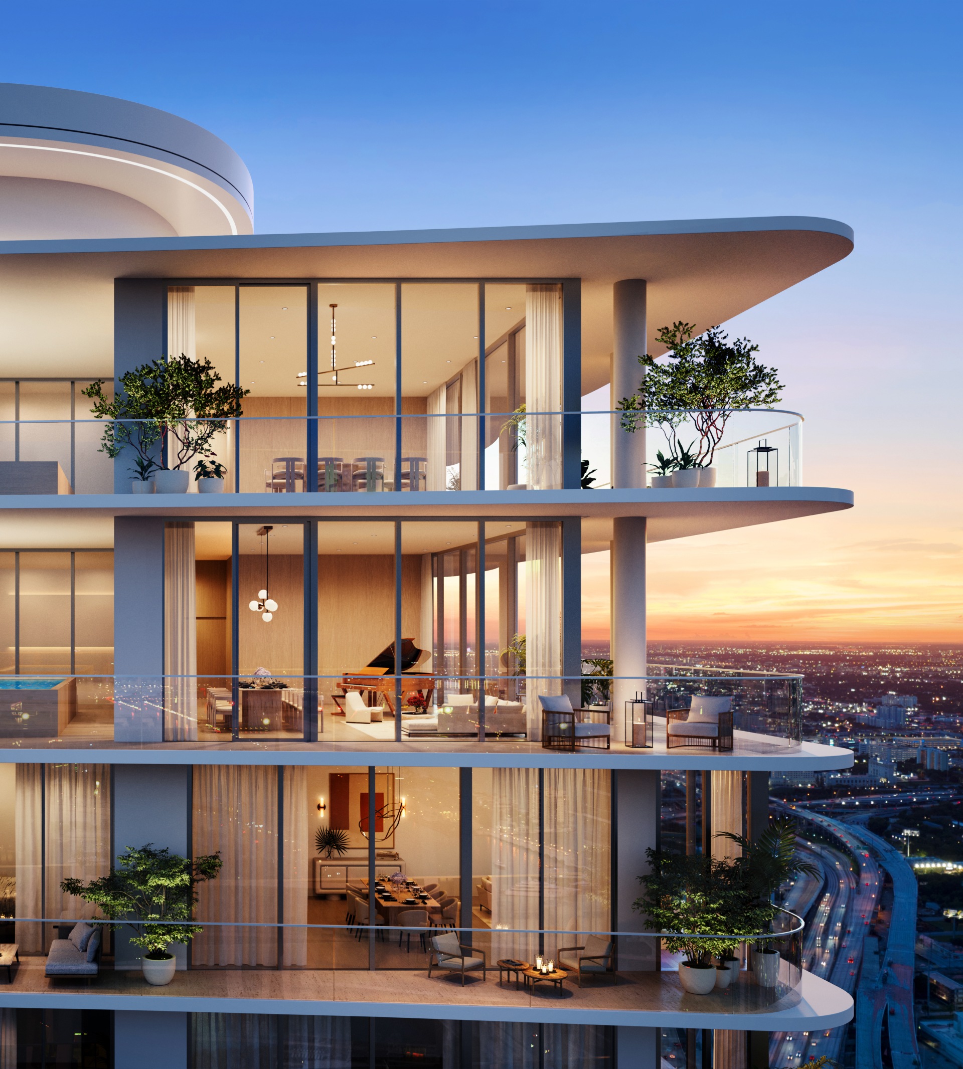The architectural crown of the JEM overlooking the spectacular sunset panorama of the water and Miami Worldcenter