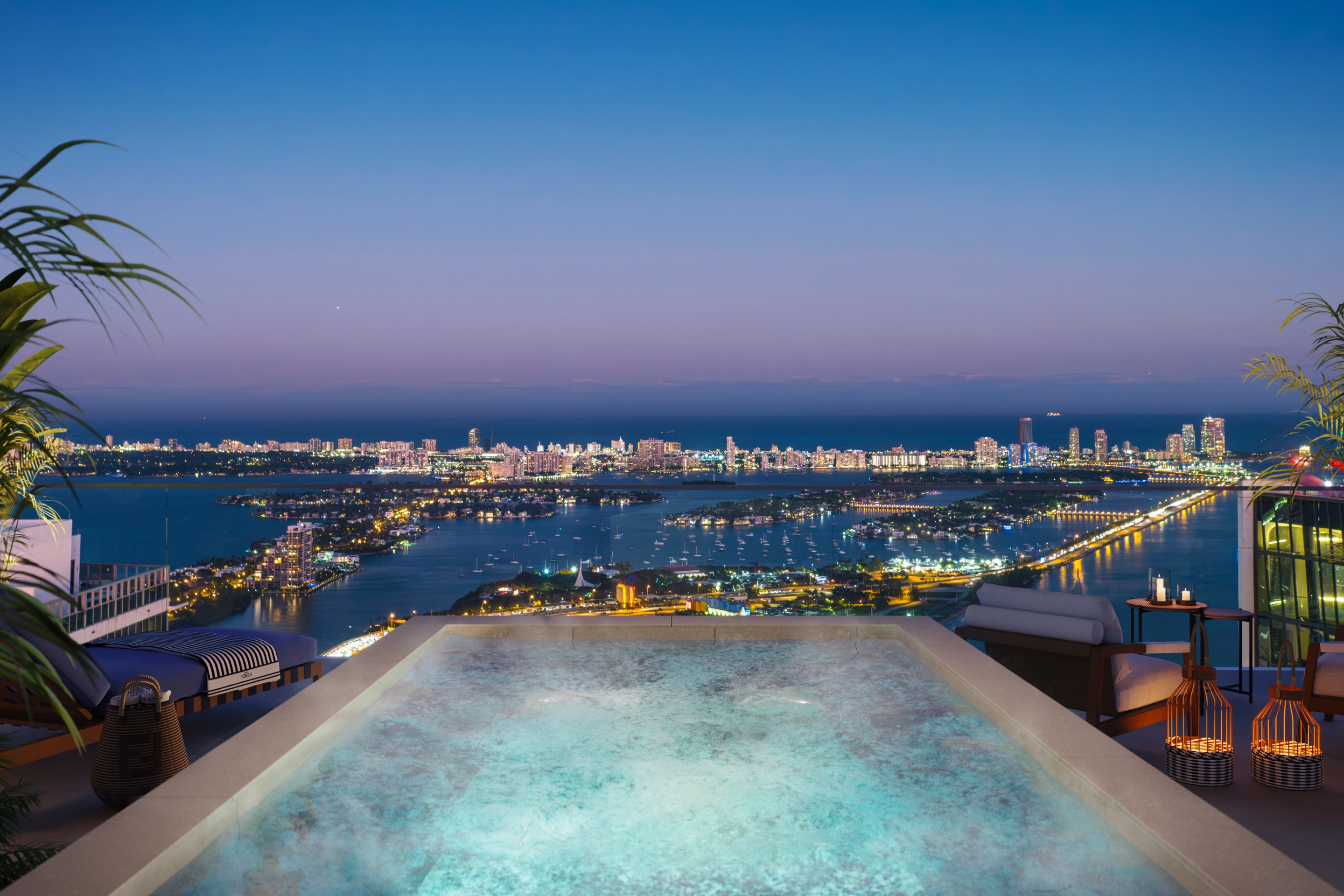 Rooftop pool at JEM overlooking Miami cityscape at night